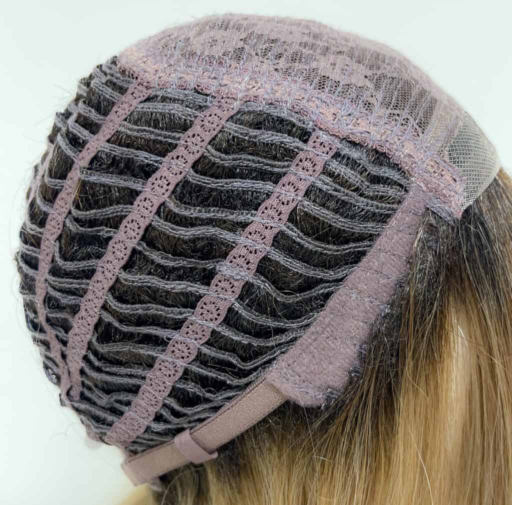 Lace front wig cap with adjustable straps and hair wefts.